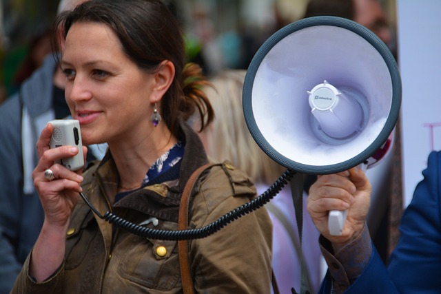 woman addressing a crowd has no fear of public speaking